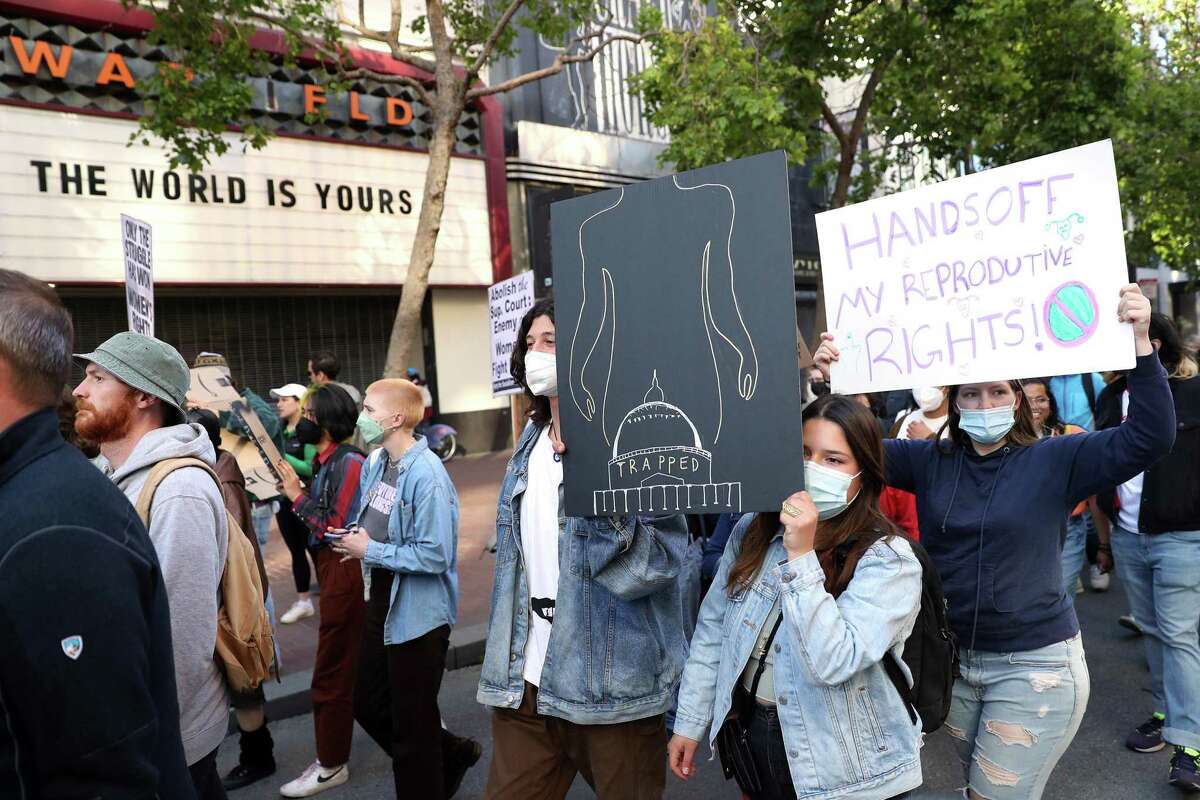Pro choice advocates march down Market Street in in San Francisco, Calif., in reaction to leaked Supreme Court Roe v Wade draft on Tuesday, May 3, 2022.