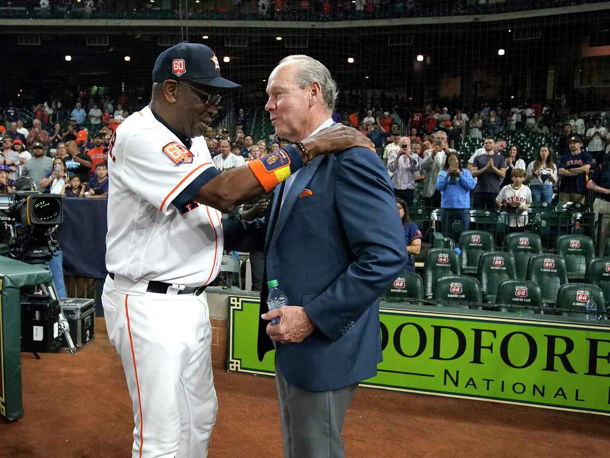 Houston Astros manager Dusty Baker Jr. (12) celebrates his 2000th win as a manager with owner Jim Crane after the Astros 4-0 win over the Seattle Mariners during an MLB baseball game at Minute Maid Park on Tuesday, May 3, 2022 in Houston.