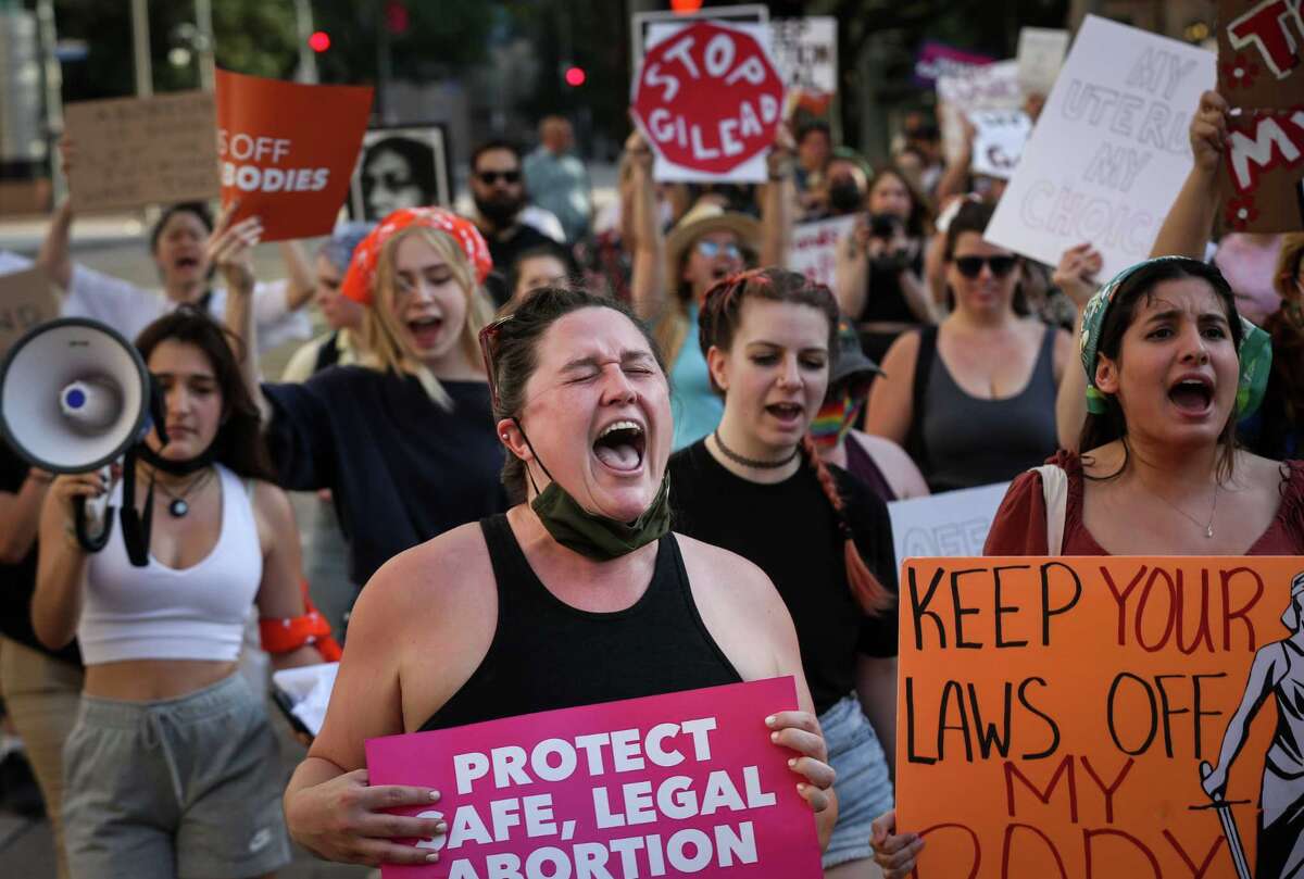 Hundreds march through downtown Houston to protest potential Roe v ...