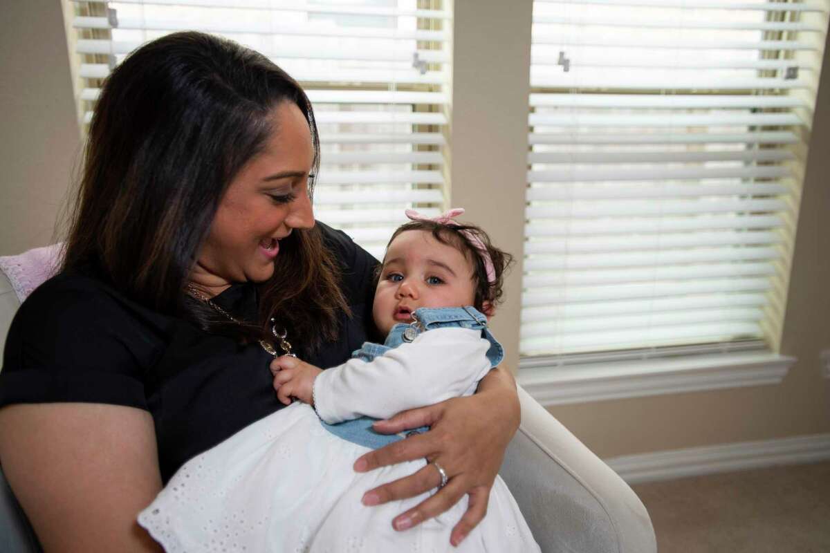 Archana Acosta holds her baby in the Acosta’s home Sunday, March 6, 2022, in Rosharon, Texas.