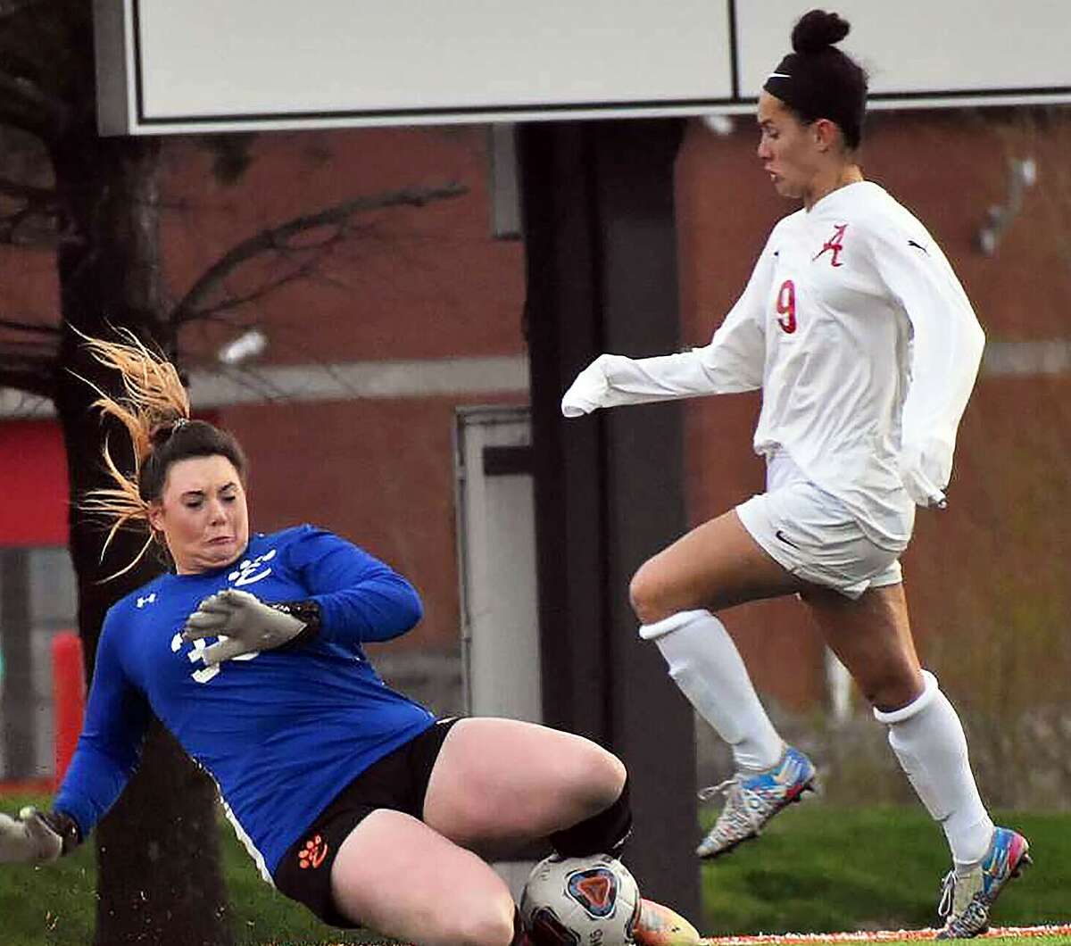 Alton's Emily Baker, right, scored a goal in her team's 2-0 win over Collinsville Tuesday.