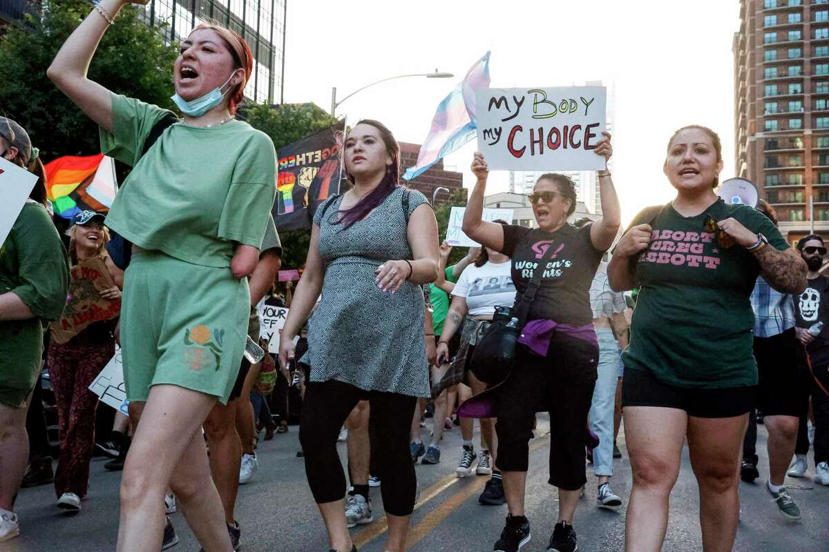 Abortion rights activists march through the streets of Downtown Austin, Texas, Tuesday, May 3, 2022, during an “emergency protest” in Austin, Texas. The protest was organized by Rainbow Coalition Austin and Texas Rise Up 4 Abortion Rights as a reaction to a leaked opinion draft from the Supreme Court that shows the court plans to overturn Roe v. Wade.