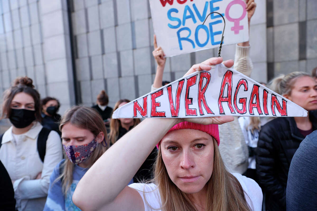 Amy P., who didn't want to provide her last name, of San Francisco, attends a protest about the Supreme Court's decision to overthrow Roe v. Wade while standing outside the Phillip Burton Federal Building on Tuesday, May 3, 2022, in San Francisco. 