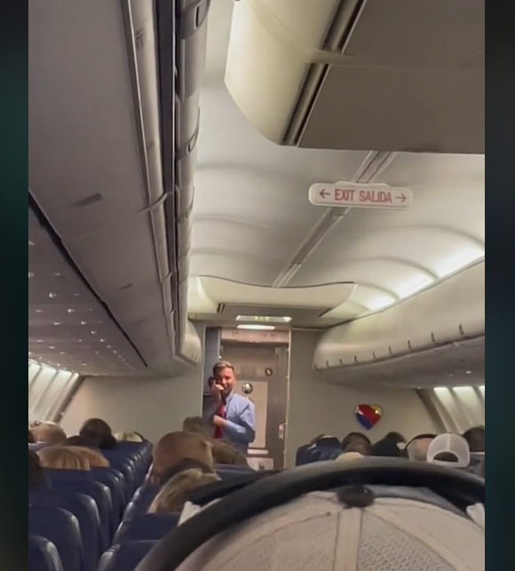 Southwest flight attendant entertains passengers on Houston flight