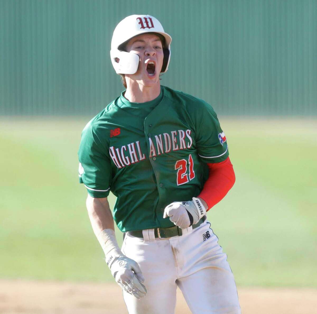 Brayden Sharp #21 of The Woodlands reacts after hitting an RBI single in the sixth inning of a high school baseball game at Oak Ridge High School, March 16, 2022.