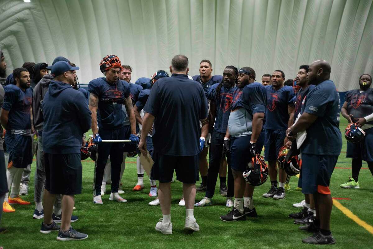 Albany Empire head coach Tom Menas talks with his players during practice on Wednesday, May 4, 2022, in Schenectady, N.Y. Menas said most players like the NAL's new footballs, but that they're not as good for kicking.