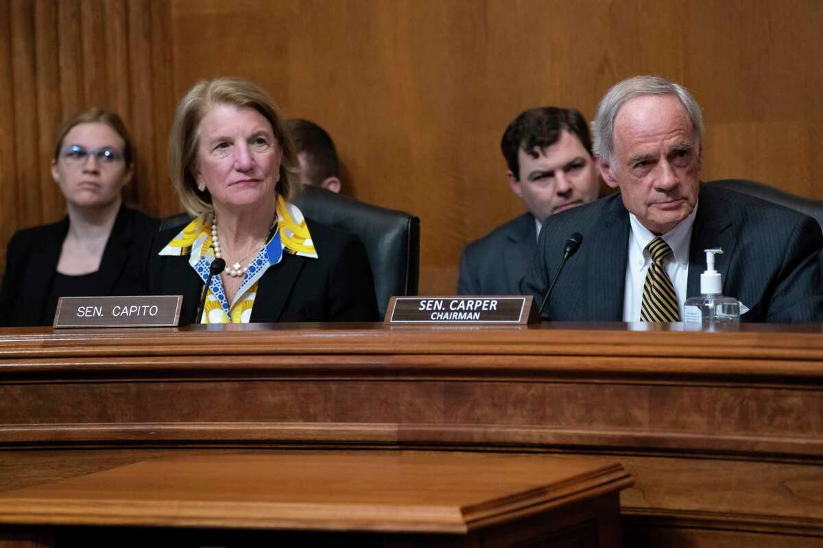 Sen. Shelley Moore Capito, R-W.Va., the ranking member, left, and Sen. Tom Carper, D-Del., chairman of the Senate Committee on Environment and Public Works, lead a business meeting to advance the Water Resources Development Act of 2022, at the Capitol in Washington, Wednesday, May 4, 2022. (AP Photo/J. Scott Applewhite)