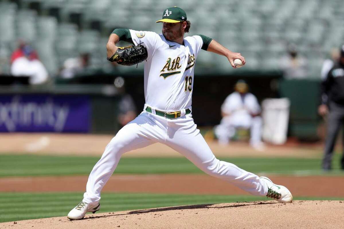Oakland Athletics starting pitcher Cole Irvin throws against the Cleveland Guardians during the first inning of a baseball game in Oakland, Calif., Saturday, April 30, 2022. (AP Photo/Jed Jacobsohn)