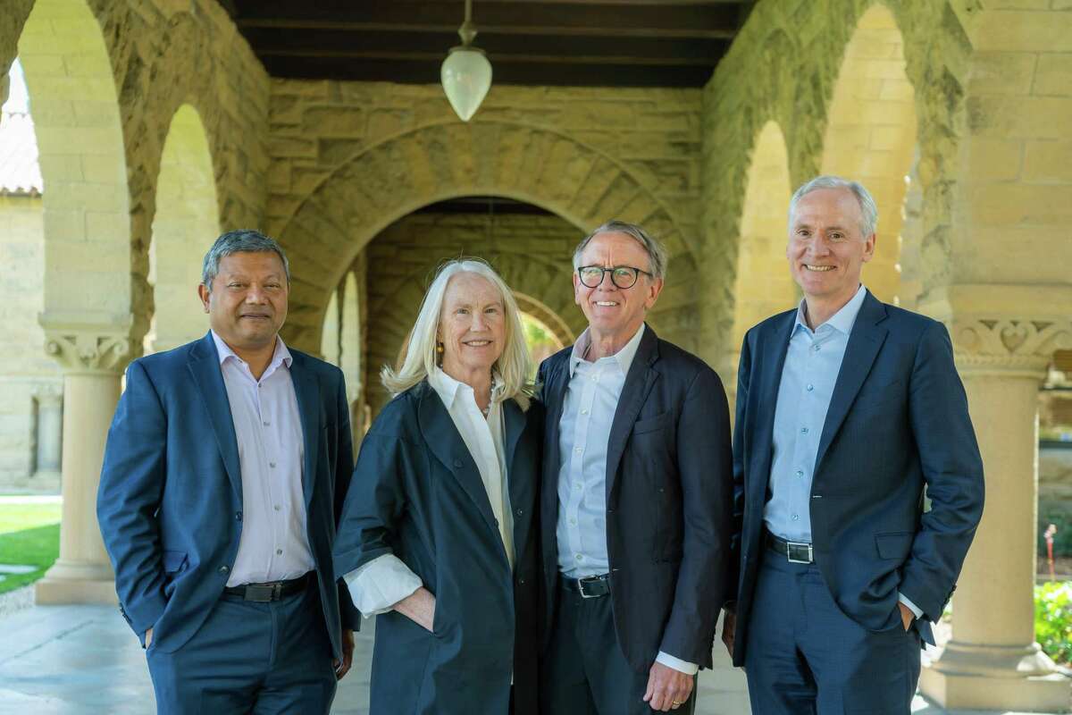 Dean Arun Majumdar (left), donors Ann Doerr and John Doerr, and Stanford President Marc Tessier-Lavigne are the founding team at the Doerr School of Sustainability.