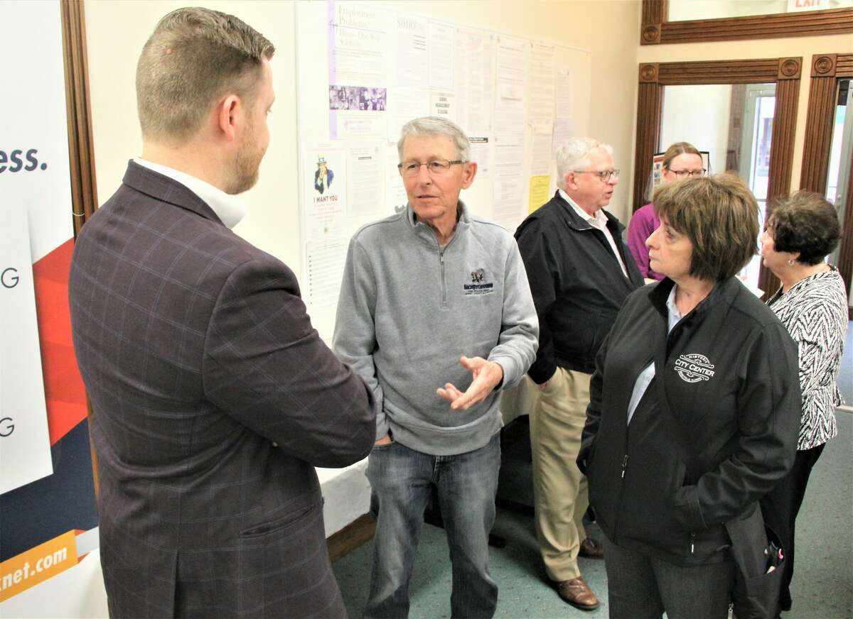 State Rep. C.D. Davidsmeyer (left) talks to Jerseyville Mayor Bill Russell at an open house for the Jersey/Calhoun Employment and Training facility at 120 W. Pearl St.