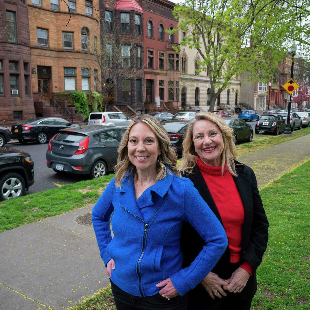 Nicole Wilkie, left, and her mom, Joyce Brown, both licensed agents with eRealty Advisors, pose for a photo in Washington Park on Wednesday, May 4, 2022, in Albany, N.Y. (Paul Buckowski/Times Union)