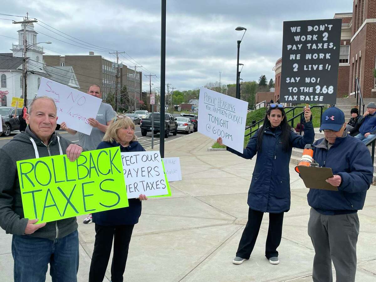 Hamden residents protest a tax increase outside Memorial Town Hall on May 3, 2022.