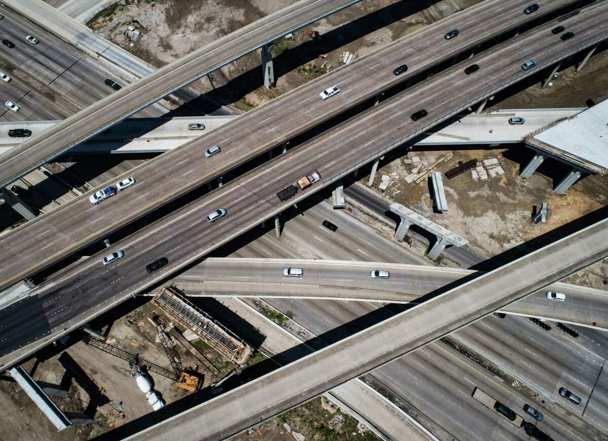 Drivers travel through the interchange of Interstate 69 and Loop 610 ner Uptown on April 27, 2022, in Houston. Crews are rebuilding the interchange, expected to finish in 2024, but that is hardly the end of major consturction for the area. In the Houston area, state highway officials plan to spend $12.5 billion over the next decade.