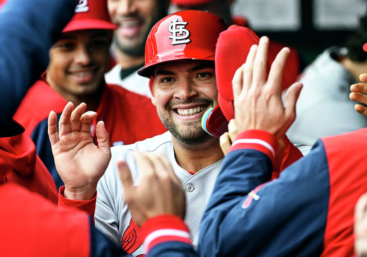 The Cardinals' Juan Yepez is congratulated in the dugout after scoring a run in the first inning Wednesday against the Royals in Kansas City, Mo.
