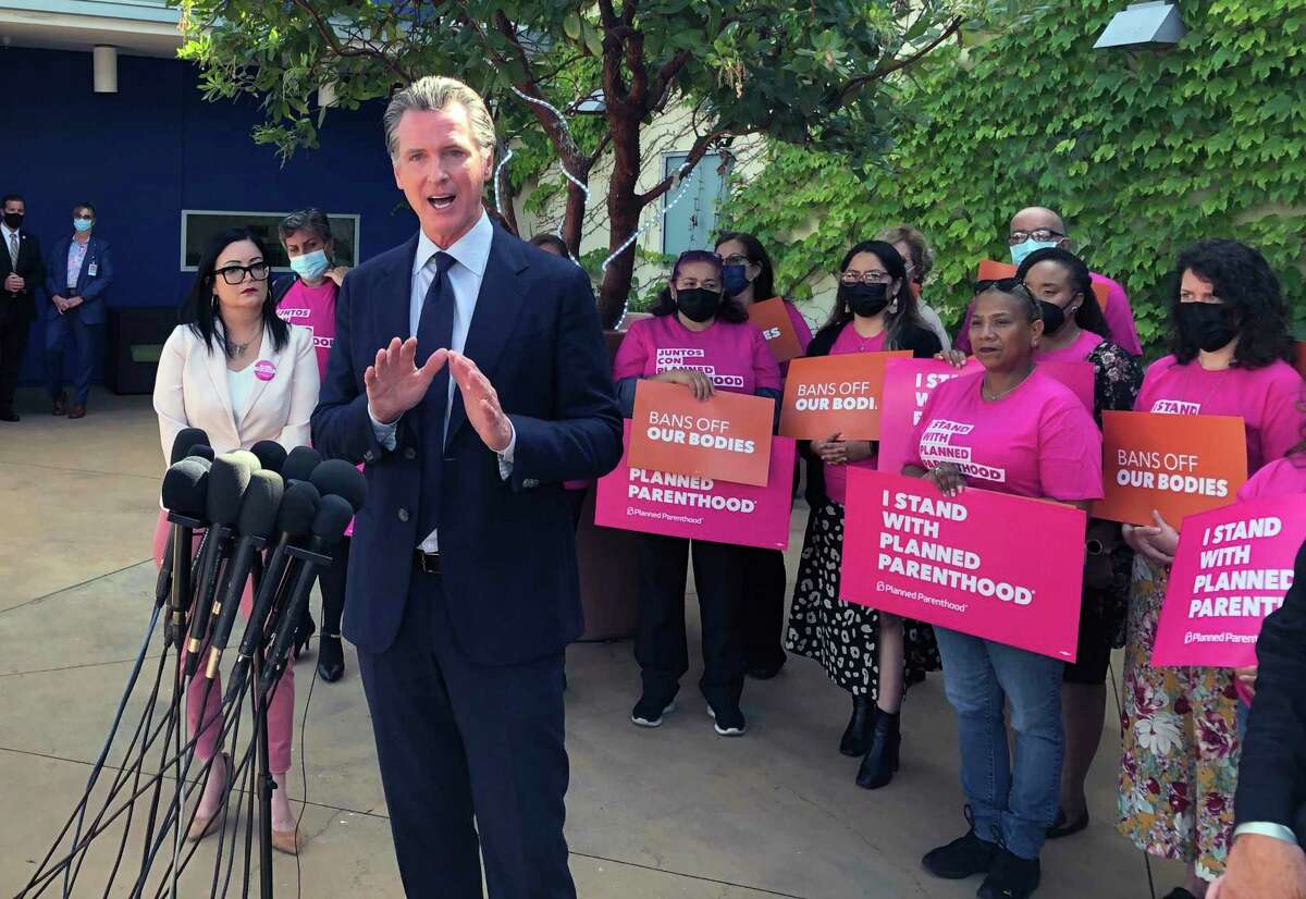 California Gov. Gavin Newsom appears with Planned Parenthood workers and volunteers on May 4, 2022, in Los Angeles.