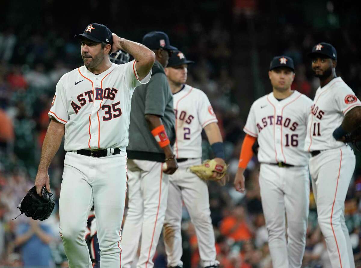 Houston Astros starting pitcher Justin Verlander (35) reacts as he was pulled by manager Dusty Baker Jr. (12) during the seventh inning of an MLB baseball game at Minute Maid Park on Wednesday, May 4, 2022 in Houston.