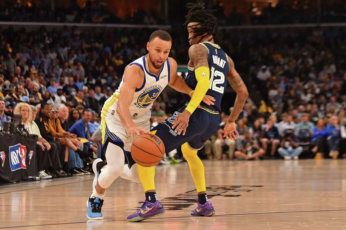 MEMPHIS, TENNESSEE - MAY 03: Stephen Curry #30 of the Golden State Warriors goes to the basket against Ja Morant #12 of the Memphis Grizzlies during Game Two of the Western Conference Semifinals of the NBA Playoffs at FedExForum on May 03, 2022 in Memphis, Tennessee. NOTE TO USER: User expressly acknowledges and agrees that, by downloading and or using this photograph, User is consenting to the terms and conditions of the Getty Images License Agreement. (Photo by Justin Ford/Getty Images)