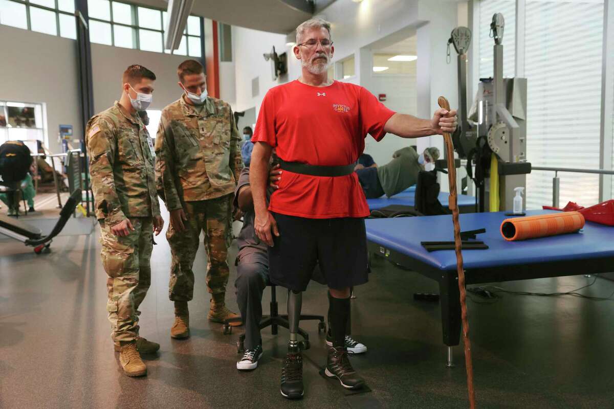 Christopher Parks, 49 — who has participated in the Warrior Games and Invictus Games — is fitted with a new prosthetic.