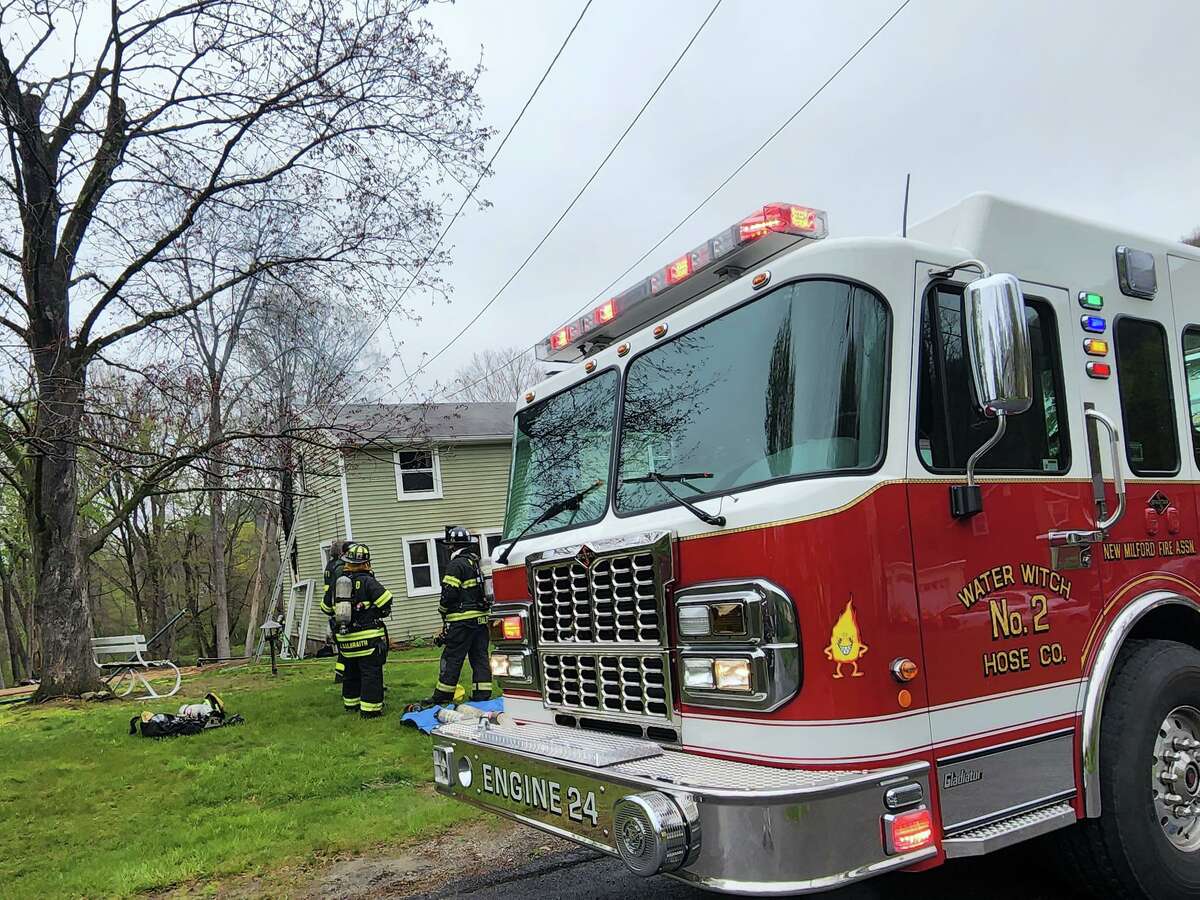 Firefighters respond to a residential structure fire on Clearview Drive in New Milford, Conn., May 4, 2022.