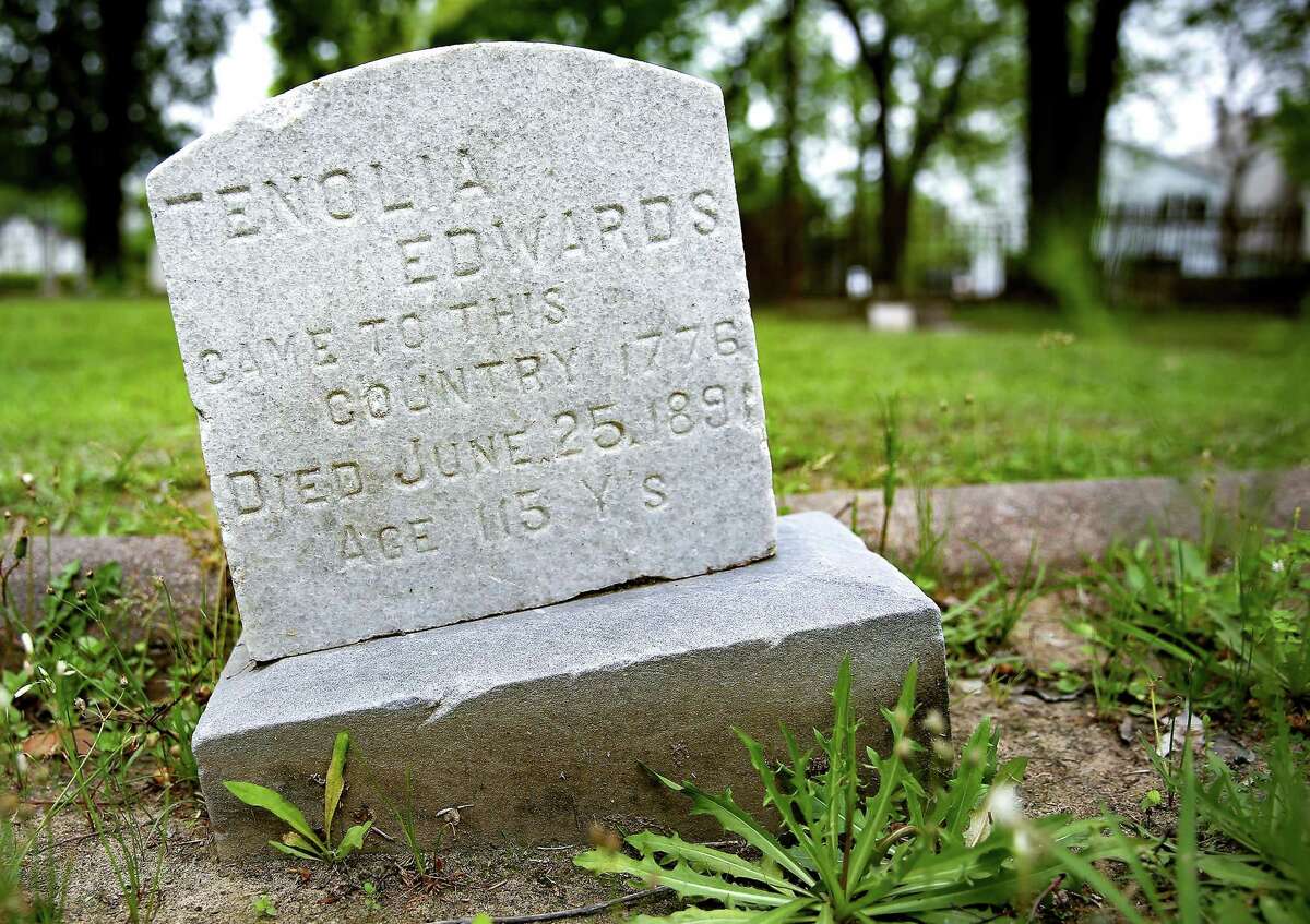 A headstone at Olivewood Cemetery in Houston on Saturday, April 3, 2021. Local historians have been using voting registration records to try to find out more about the less famous buried at the cemetery.