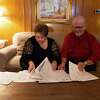Lewis "Deakon" and Mary Keener, of Dallas, sort through documents they saved to prove their credit card was fraudulently used to charge $17,000 in a cruise, hotel and international airfare. The matter was recently settled as part of a lawsuit for an undisclosed amount. The charges were removed from Deakon Keener’s account.