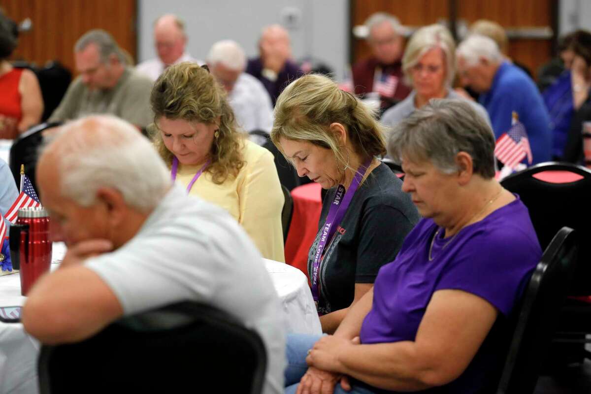 Community members pray during a celebration of National Day of Prayer at the Lone Star Community Center, Thursday, May 5, 2022, in Montgomery.