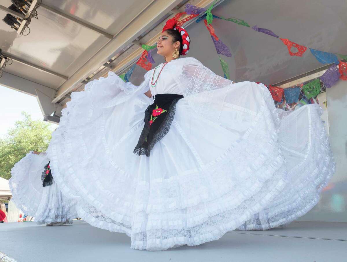 Members of Ballet Folklórico from Hispanic Cultural Center of Midland perform for elementary school children from around the area during the Cinco de Mayo celebration 05/05/2022 outside the Hispanic Cultural Center of Midland at Hogan Park. Tim Fischer/Reporter-Telegram