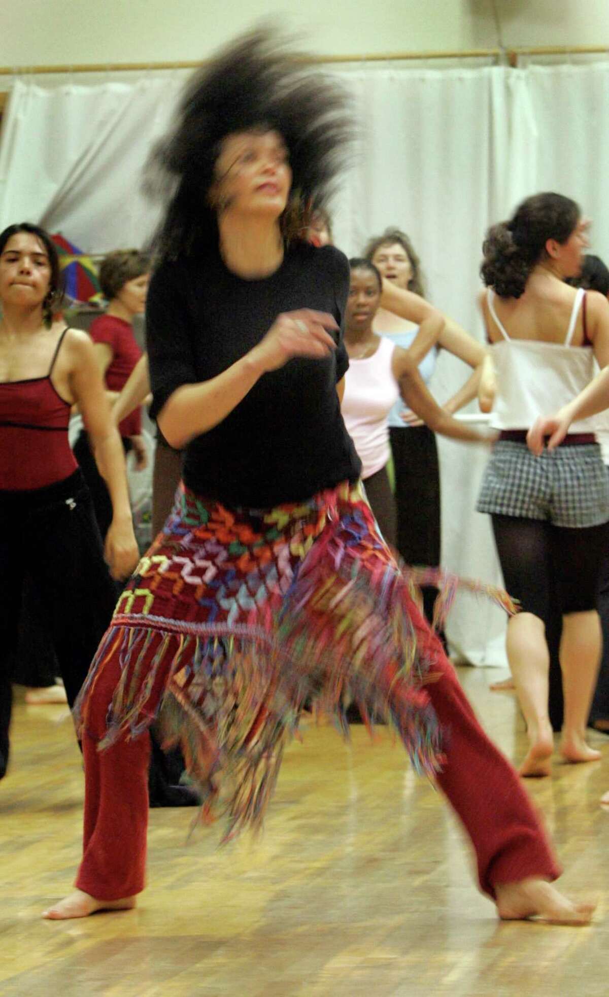 Conceição Damasceno dances with her class in 2005.