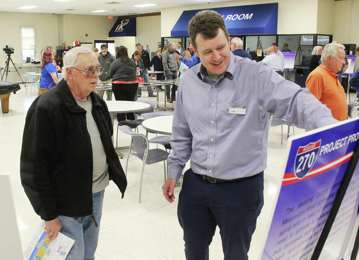 Charles McConnell, left, of Granite City, talks to Missouri Department of Transportation representative Aaron Hugenberg during a public meeting Wednesday on the construction of a new I-270 Chain of Rocks Bridge. The meeting was held at the Southwestern Illinois College's Granite City Campus, and was intended to give people information about traffic patterns during construction, which could begin as soon as this fall.