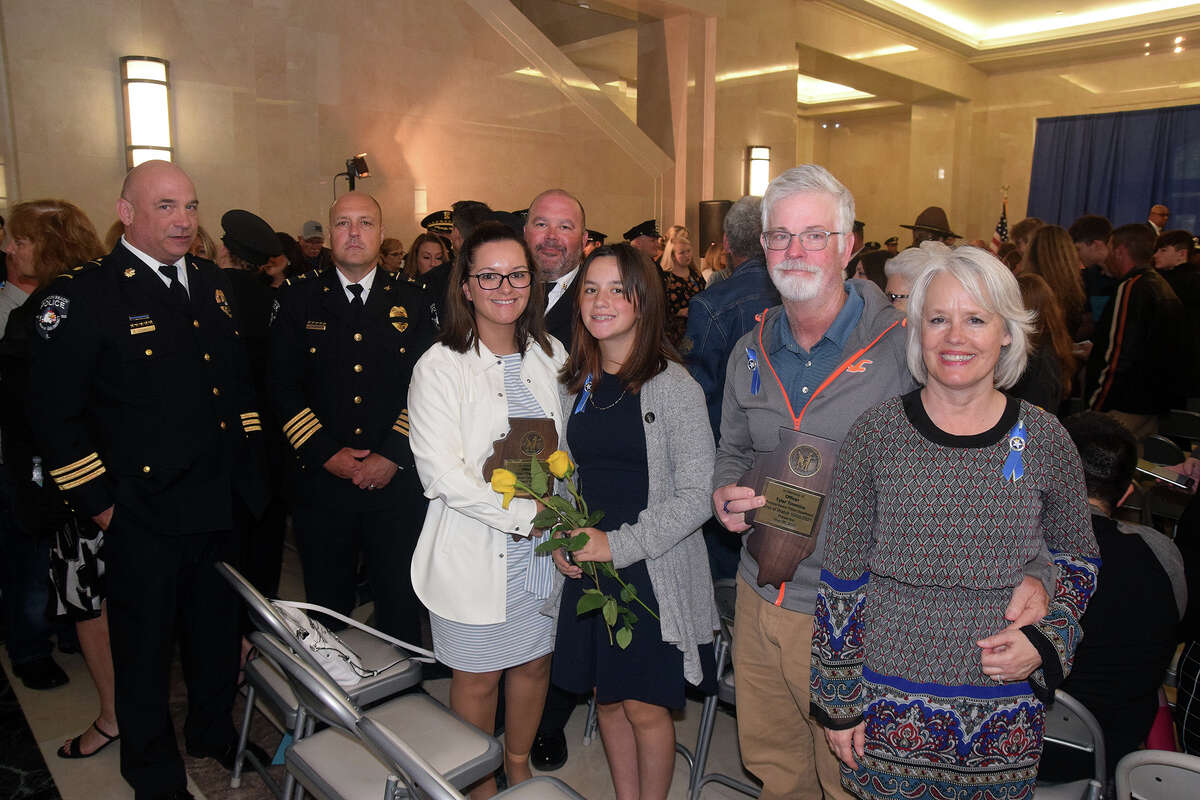 Members of the Timmins family and Pontoon Beach Police officers who attended Thursday's Police Memorial Ceremony in Springfield. The late Pontoon Beach Officer Tyler Timmins was one of 11 honored during the ceremony.     