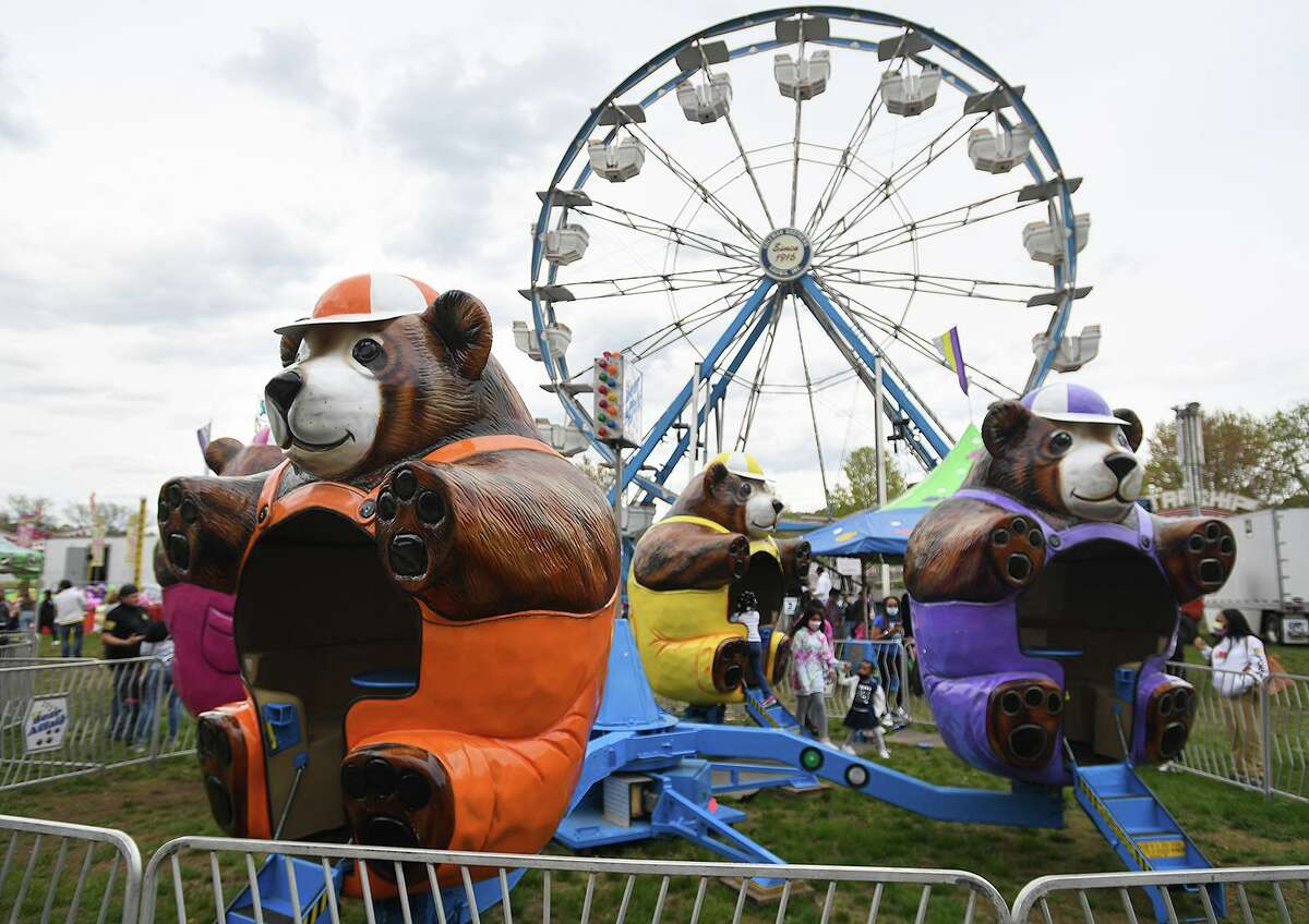 The Coleman Brothers carnival sees a healthy turnout of visitors at the Riverwalk in Shelton, Conn. on Sunday, May 9, 2021.