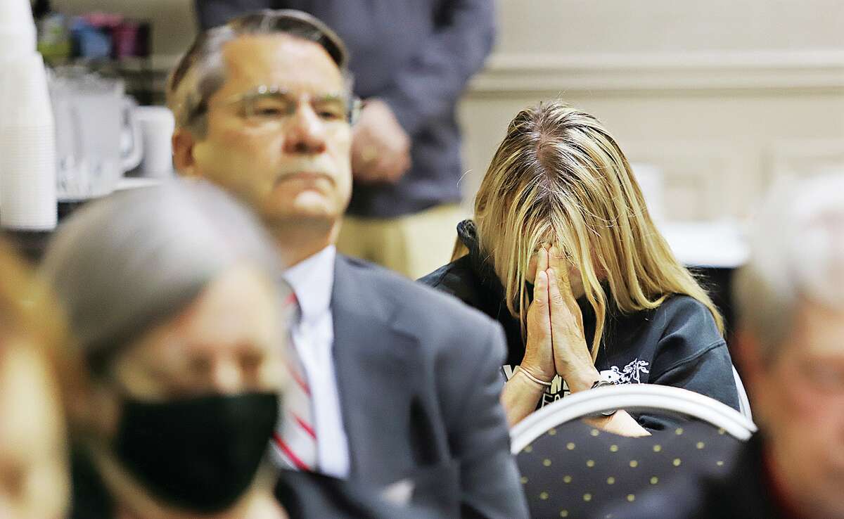 John Badman|The Telegraph A woman prays Thursday morning in the Premier Best Western hotel in Alton during the National Day of Prayer event. Prayers were said for emergency workers, health care providers, educators, the family, business and the military, among others.