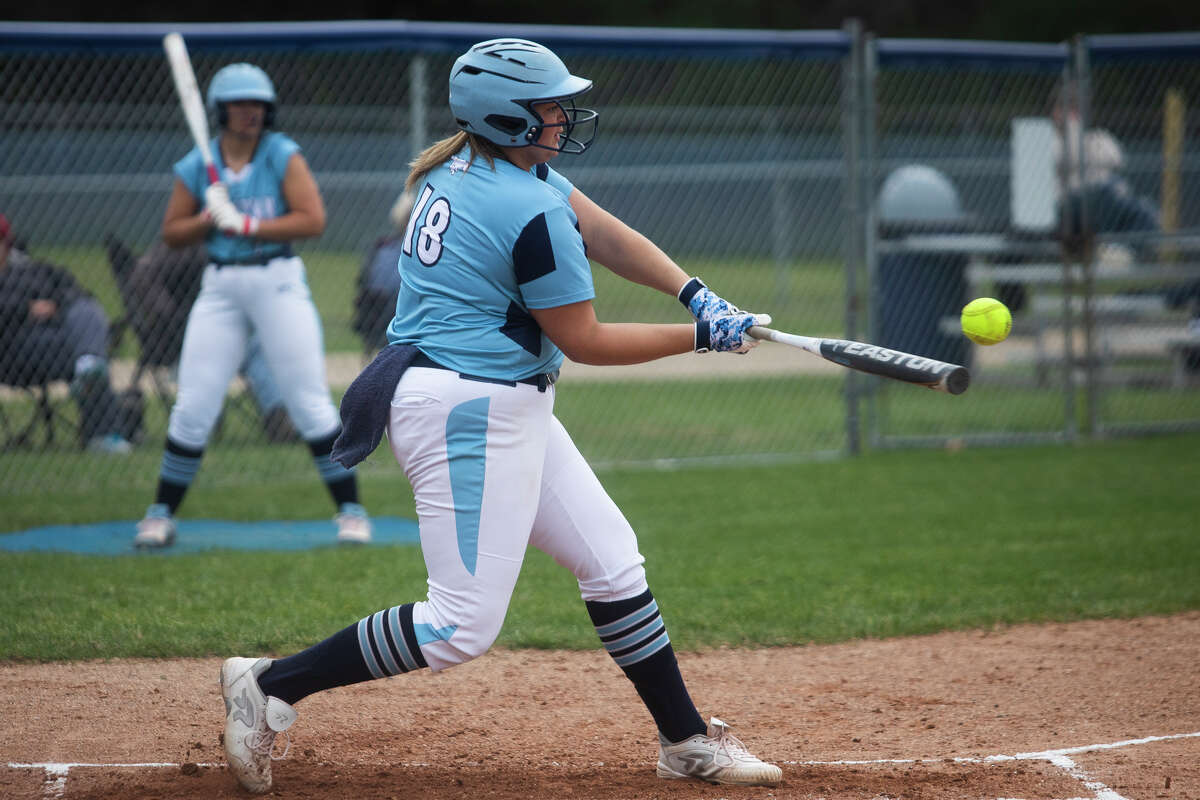 Meridian's Kelsey Merillat swings on a pitch during a game against Gladwin Thursday, May 5, 2022 at Meridian Early College High School.