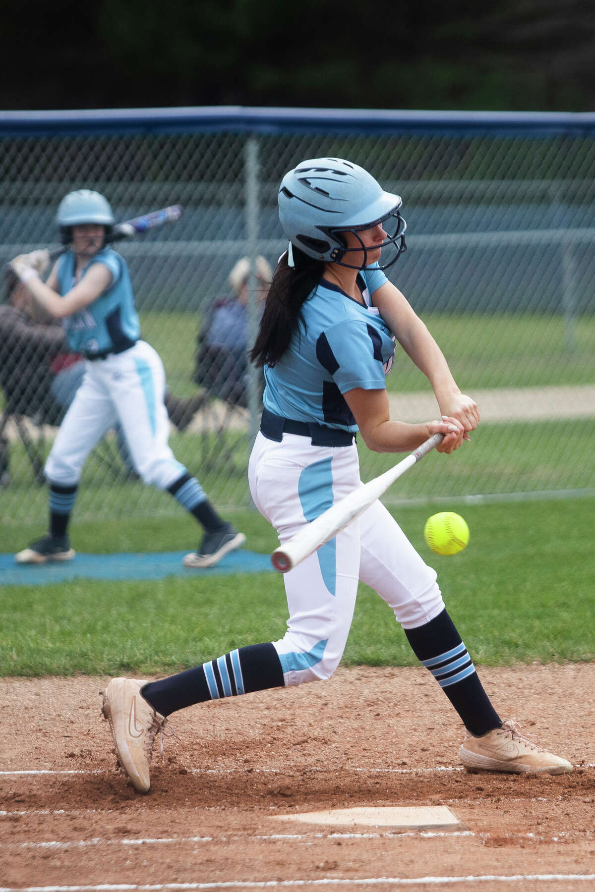 Meridian's Taylor Hopkins swings on a pitch during a game against Gladwin Thursday, May 5, 2022 at Meridian Early College High School.