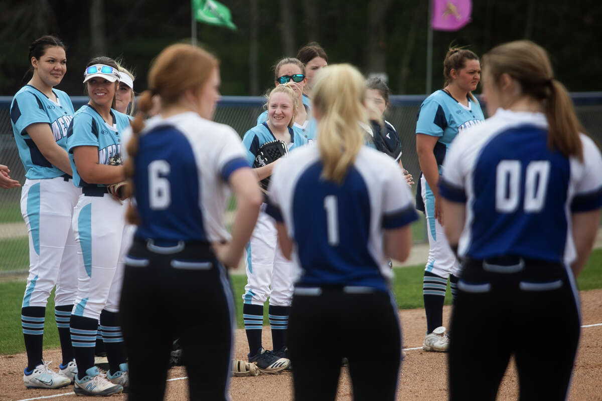 Meridian and Gladwin players line up before their game Thursday, May 5, 2022 at Meridian Early College High School.