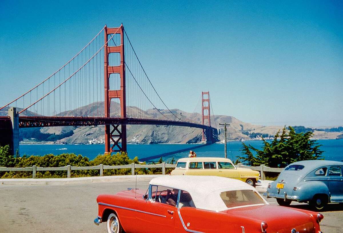 The Golden Gate Bridge and Marin County, as viewed from a parking lot near Fort Point on the San Francisco side, circa 1950s.