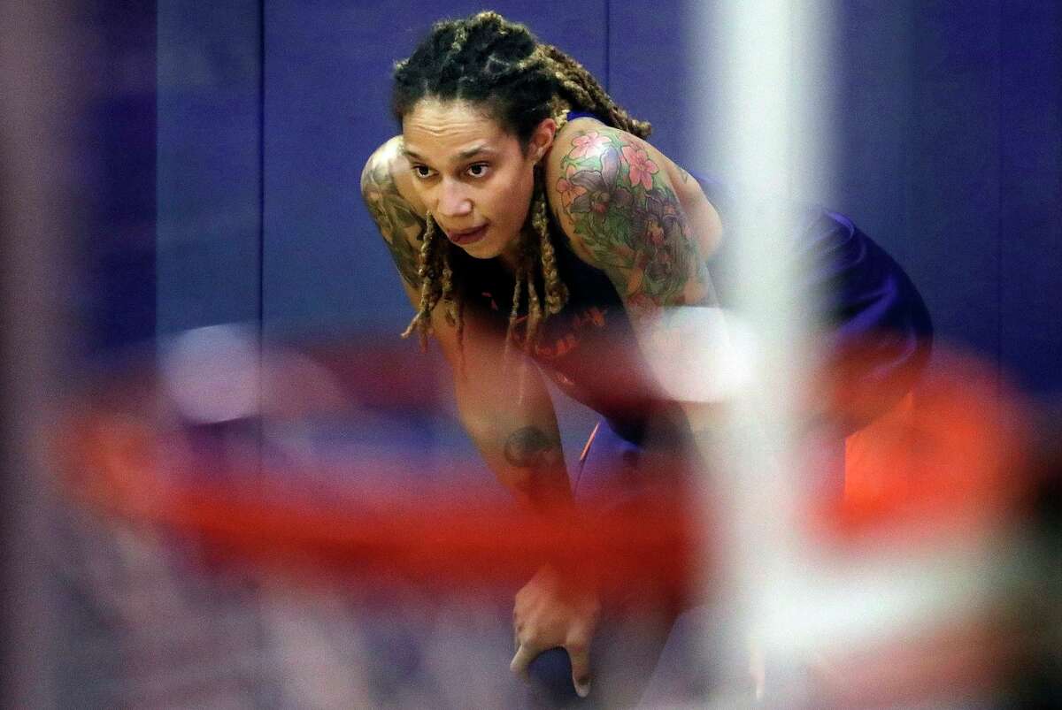 FILE - Phoenix Mercury's Brittney Griner watches during WNBA basketball practice on May 10, 2018, in Phoenix. The WNBA will begin its 26th season this weekend with many fascinating storylines including the potential retirement of Sue Bird and Sylvia Fowles, the return of Becky Hammon as a coach and the absence of Brittney Griner. (AP Photo/Matt York, File)
