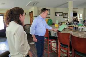 Lamont tours greenhouses, brewery at Northford farm