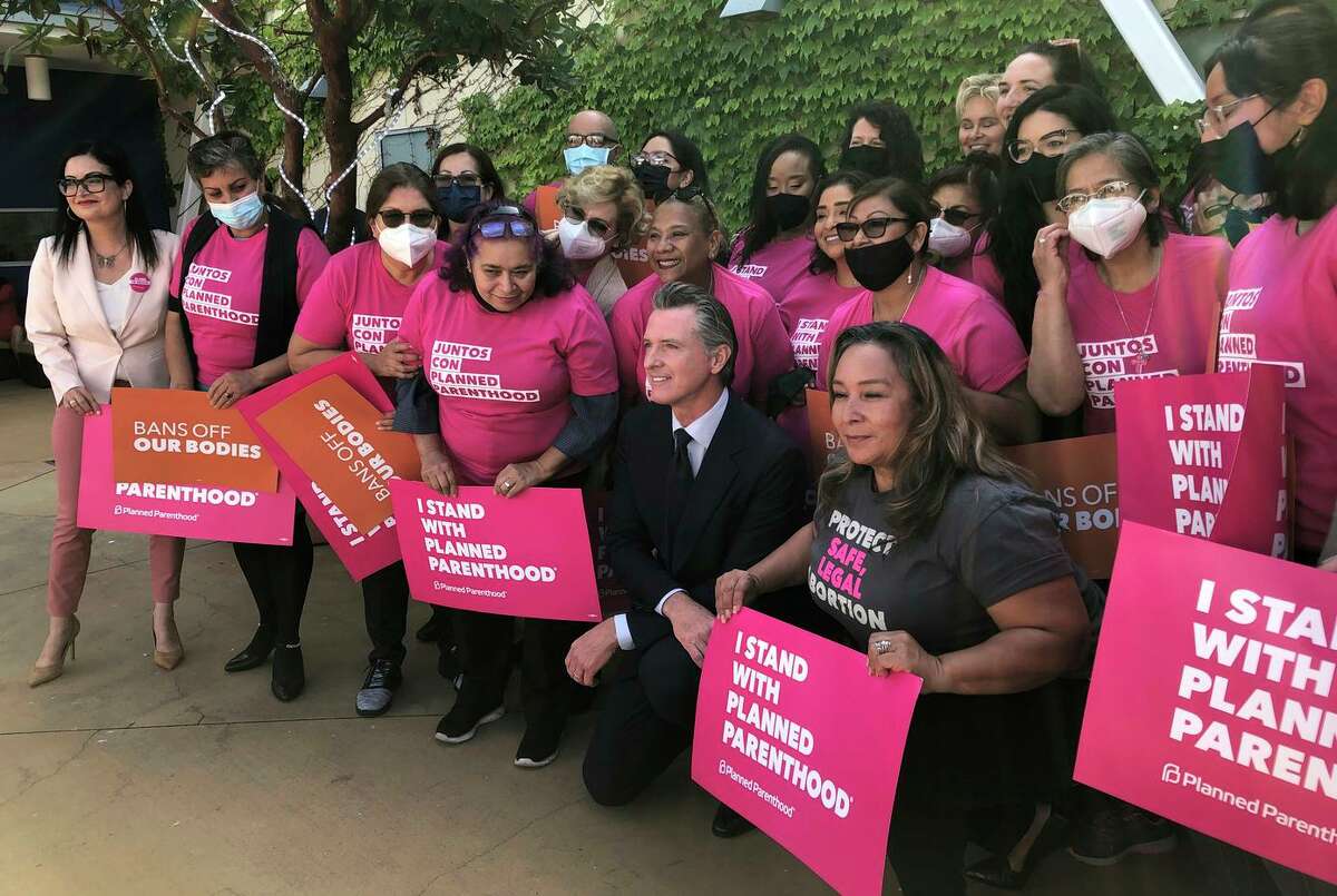 California Gov. Gavin Newsom, shown with Planned Parenthood workers and volunteers in Los Angeles on Wednesday, is backing a proposed constitutional amendment enshrining the right to an abortion.