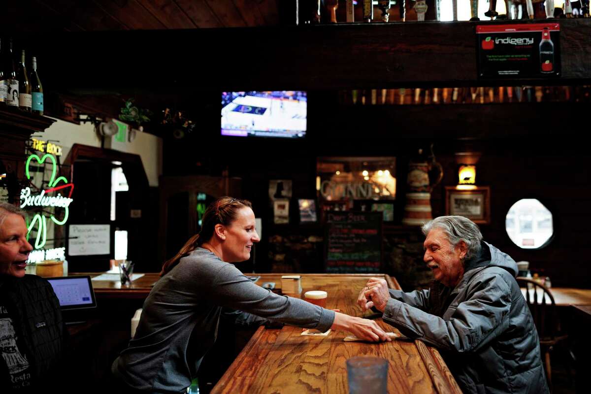 Server Melissa Carne helps a customer at the Rock of Twain Harte in Twain Harte. The pandemic led to the restaurant’s worst year financially during 2020, but also its best year ever in 2021.
