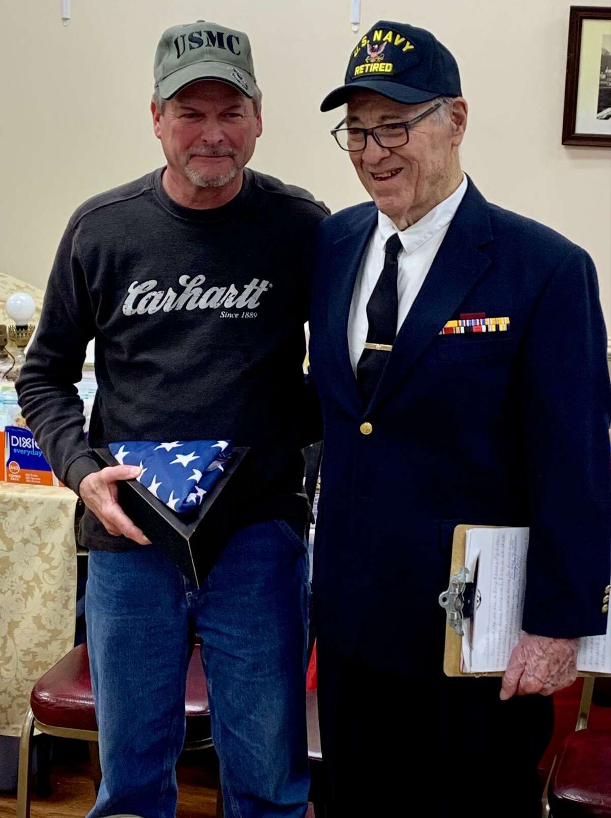 Riverton American Legion Post #159 Color Guard presents retired American flag to April Veteran of the Month John Yacawych.