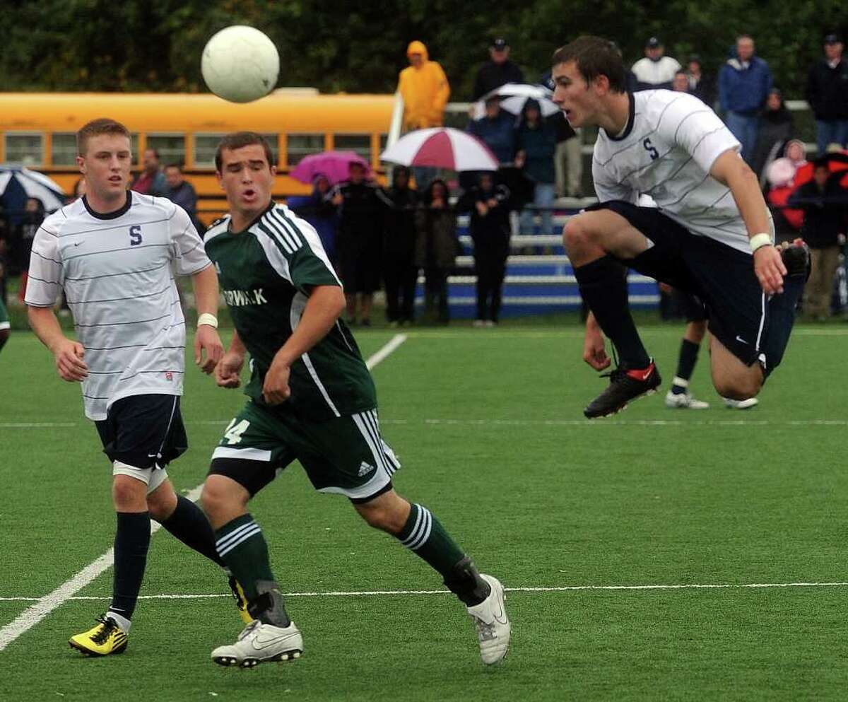 From left, Staples' Brendan Lesch, Norwalk's Spencer Jacoby, and Staples' Sean Gallagher compete during Friday's game in Westport on October 1, 2010.