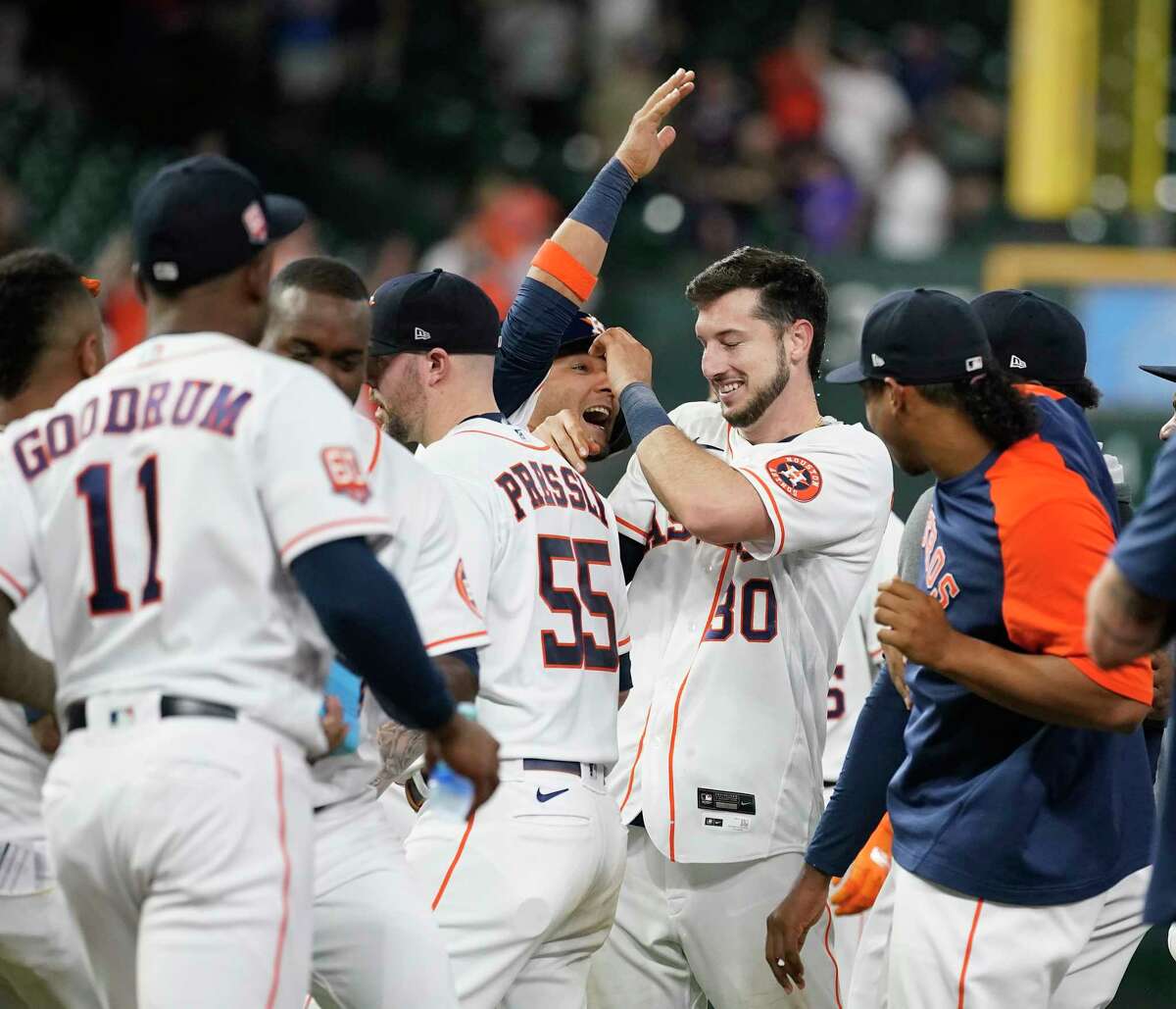 Houston Astros Kyle Tucker (30) celebrates with teammates after he hit an RBI single which scored the game wining run during the ninth inning of an MLB baseball game at Minute Maid Park on Thursday, May 5, 2022 in Houston.