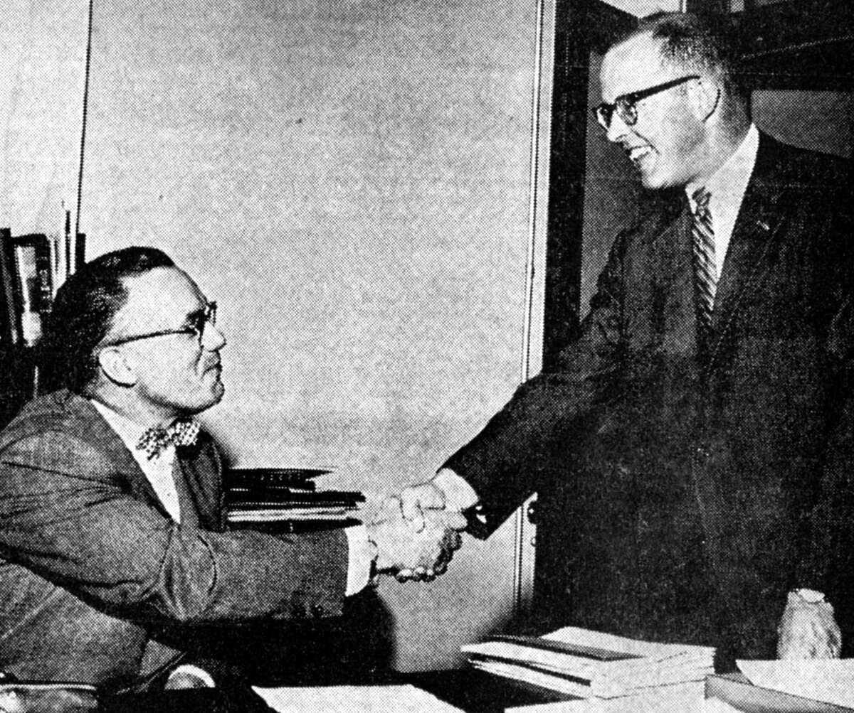 Sam Henry (right) who took over his new duties as secretary-manager of the Manistee County Board of Commerce yesterday is being welcomed by Harry Zimmerman who resigned the job to take a position with the Hotel Chippewa. The photo was published in the News Advocate on May 8, 1962