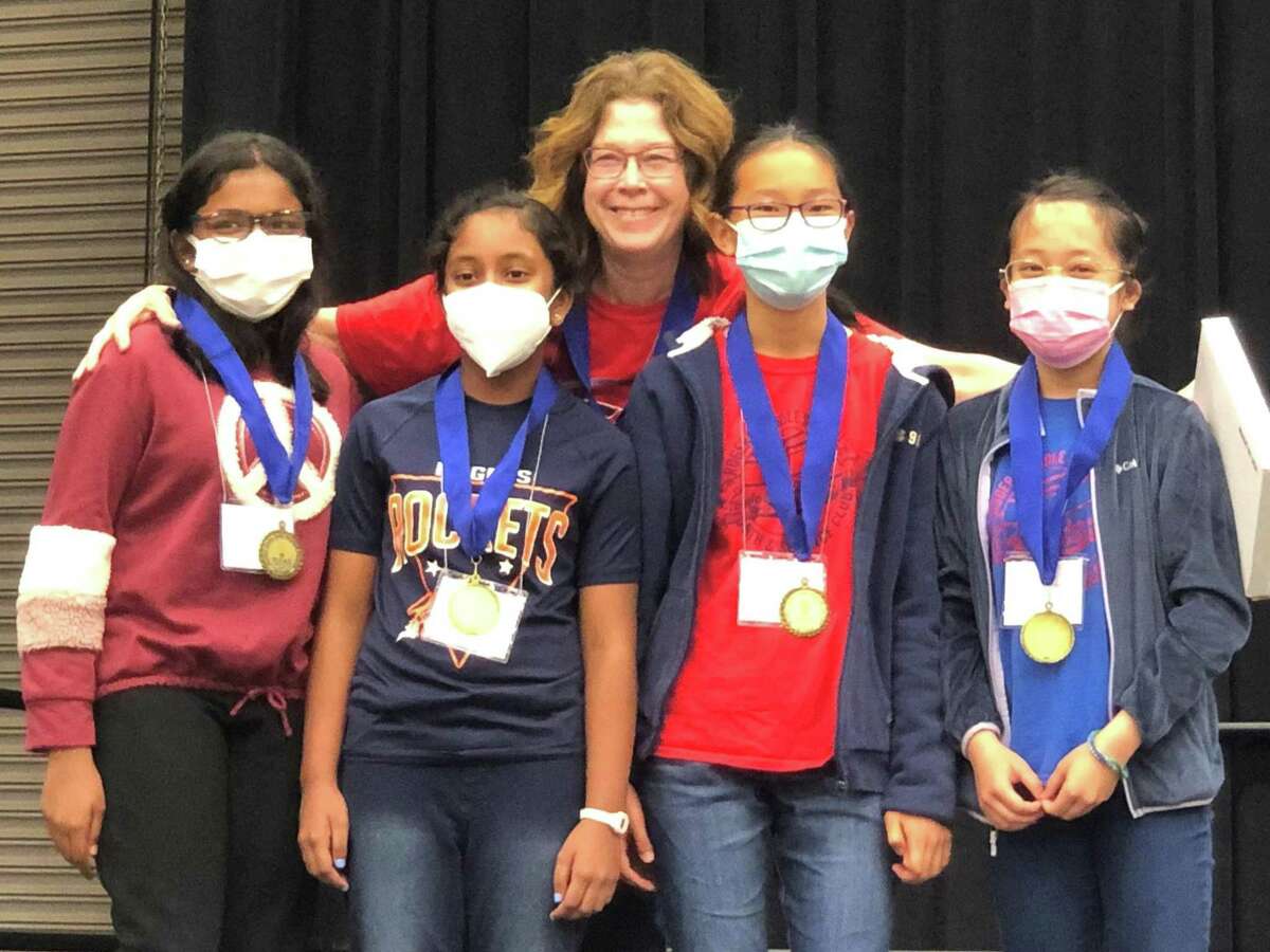 Rogers Middle School students gather with medals after their win in the Global Issue Problem Solving junior team division at the Texas Future Problem Solvers State Bowl in April.