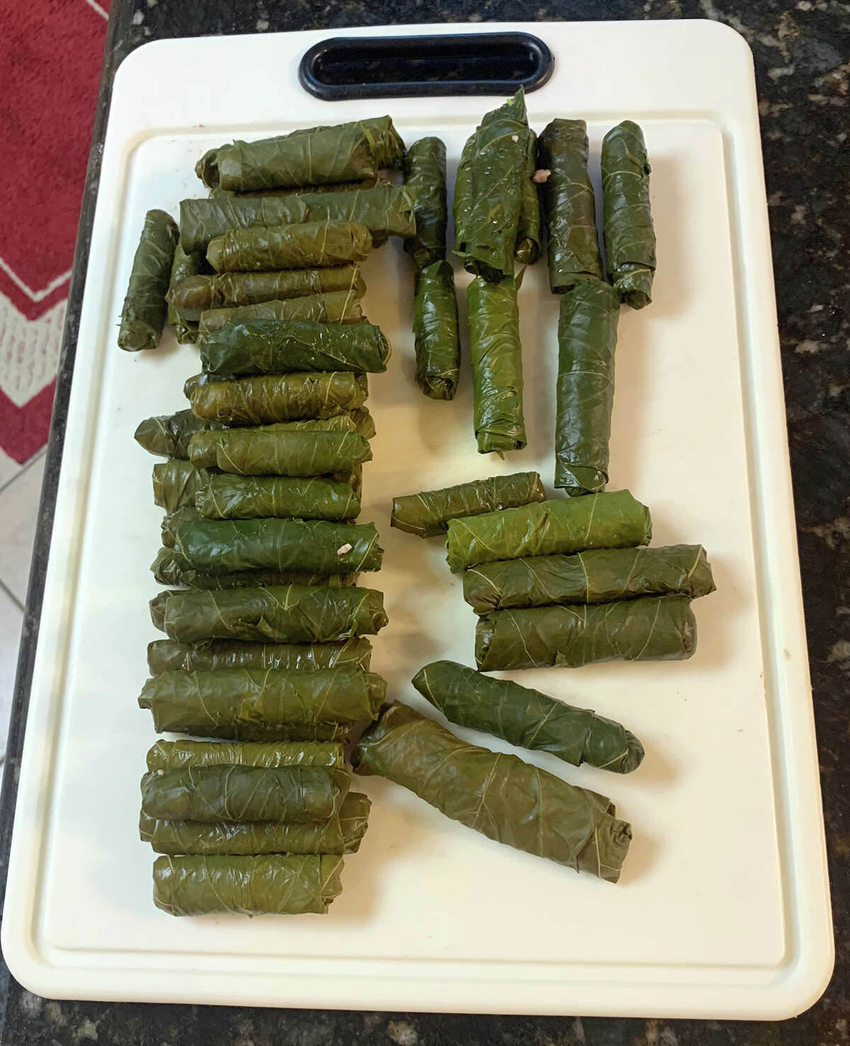 Freshly rolled dolmas ready to cook. Photo by Andy Coughlan