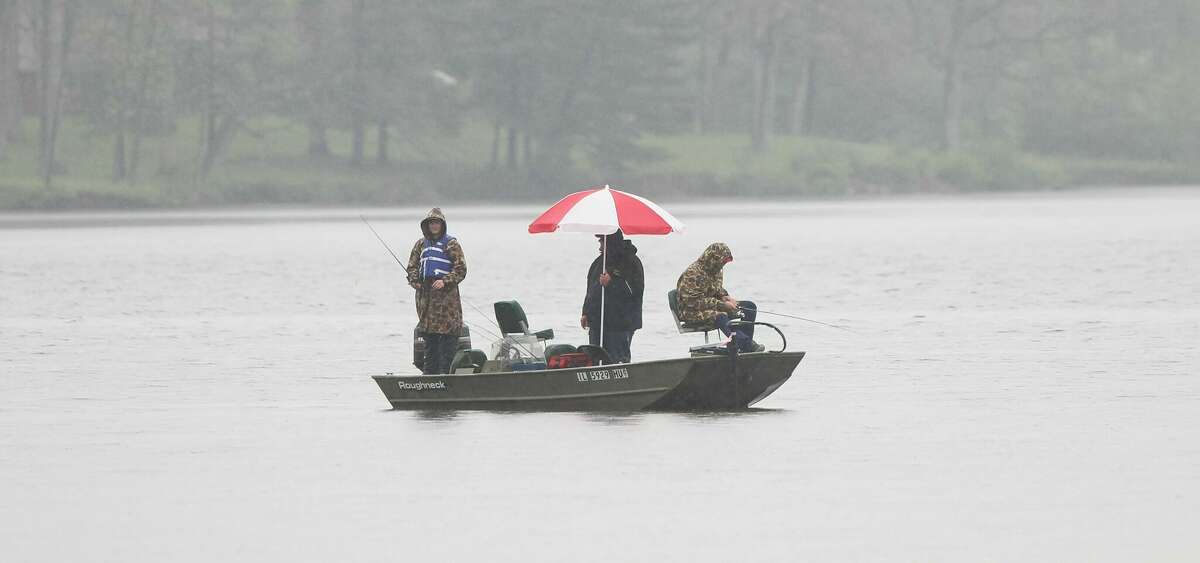 Anglers cope with the rain as they compete in the IHSA Lake Jacksonville Bass Fishing Sectional on Thursday.