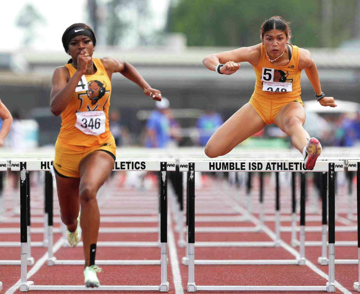 Marshall’s Tairah Johnson (right) is the defending state champion in the 100-meter hurdles and teammate Desirae Roberts figures to give her a good test at the state track meet this weekend.