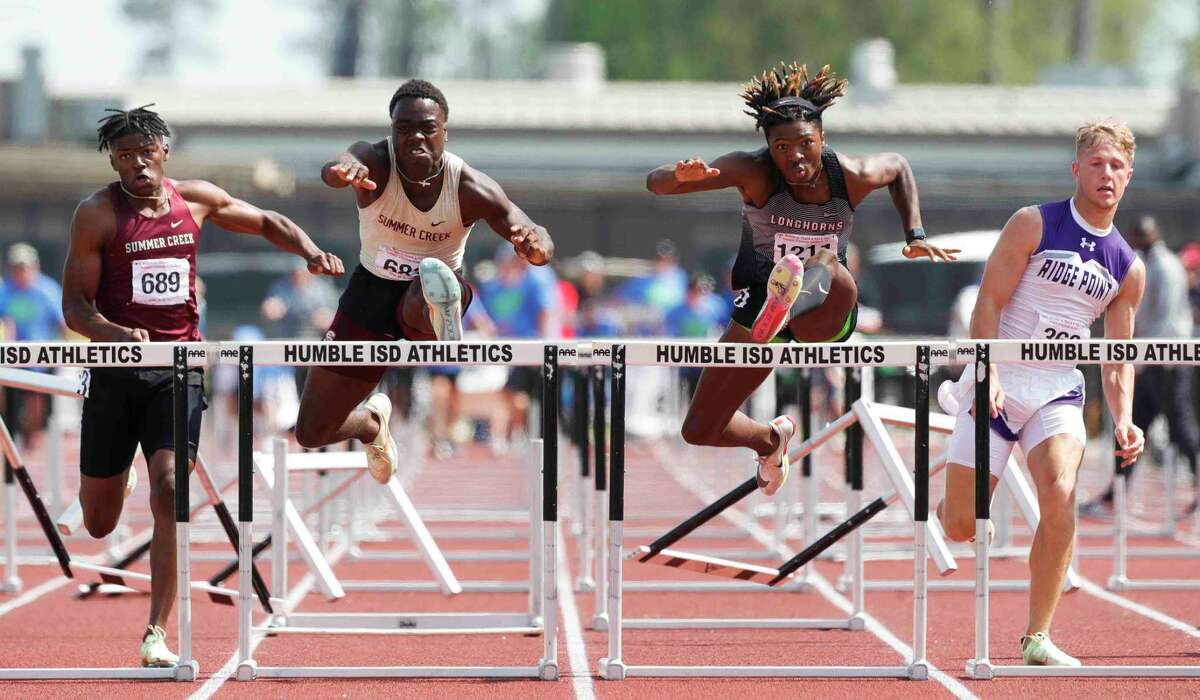 Summer Creek's Donovan Bradley competes against George Ranch’s Shane Gardner in the Class 6A boys 110-meter hurdles during the Region III track and field championships at Turner Stadium, Saturday, April 30, 2022, in Humble.