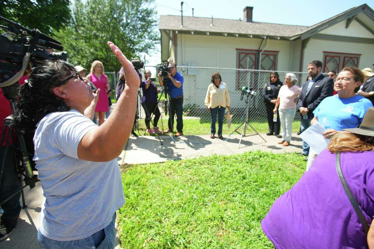 Linda Vallejos, left, speaks during a news conference calling on the Salvation Army to hire security services if it reopens its Northside facility, May 6, 2022 in Houston.soon. Members of the community spoke out against the reopening.